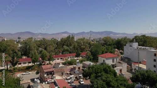 Aerial 4k Nicosia Old Town with Great Inn(Büyük Han), Selimiye Camii(Ayia Sophia Cathedral), Gambler's Inn(Kumarcılar Hanı), First Cypriot Council Houses(Samanbahçe Evleri) in North Cyprus photo