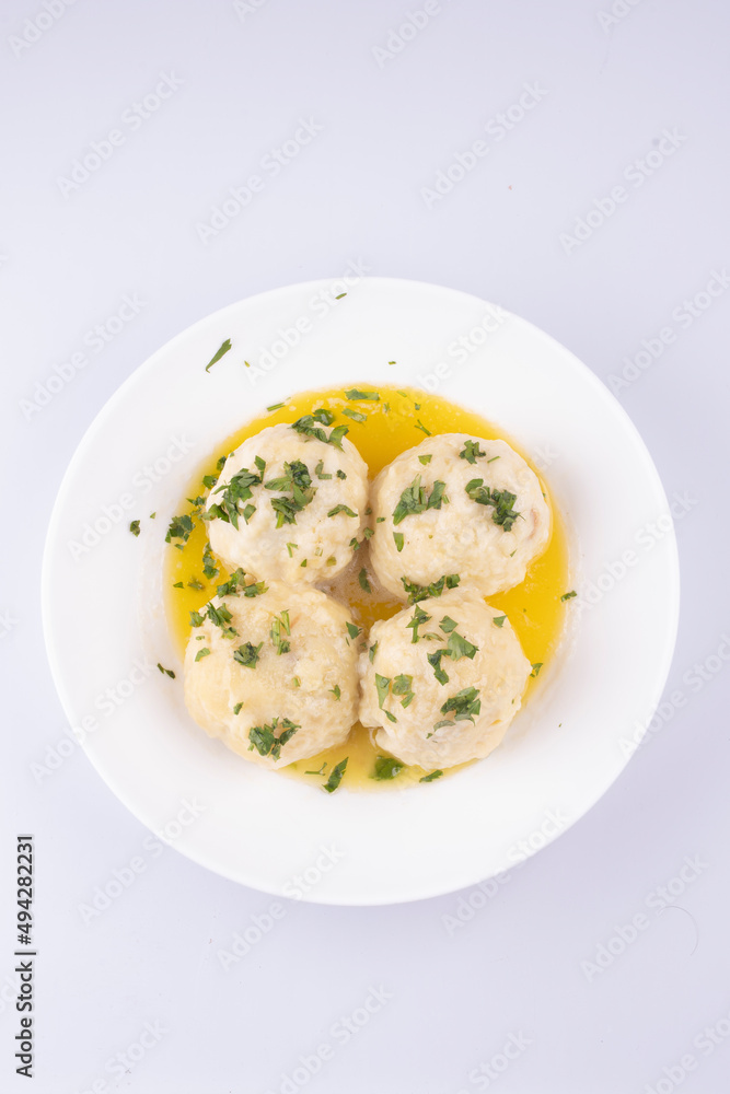 knodel dish with green onions isolated on white background top view knodel dish with green onions isolated on white background top view