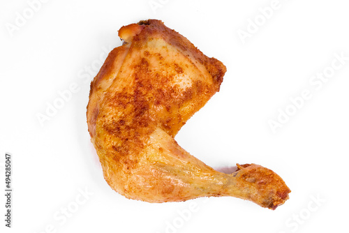 Fresh roasted chicken leg quarters on white isolated background.
