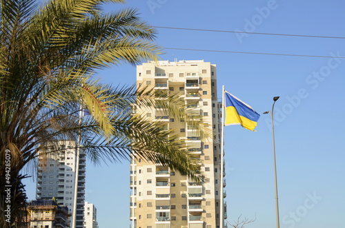 Israel supports Ukraine. Yellow and blue flag on the street of Tel Aviv