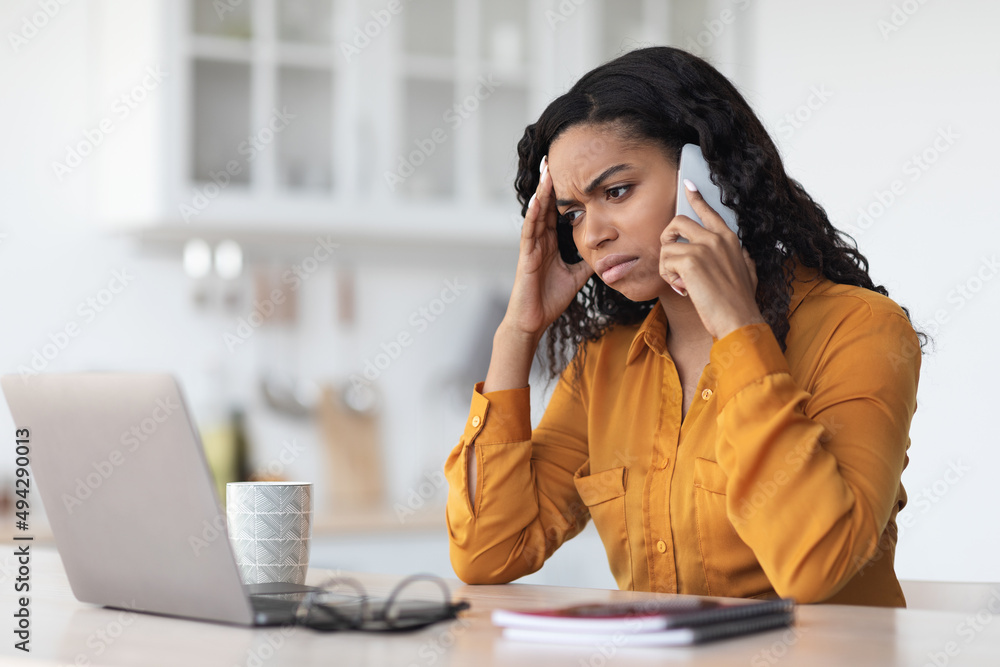 Annoyed black lady independent contractor working from home Annoyed black lady independent contractor working from home