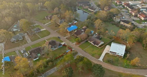 American apartment complex of residential condominimum quarter of aerial viewed in near small pond in Denham Springs Louisiana USA photo