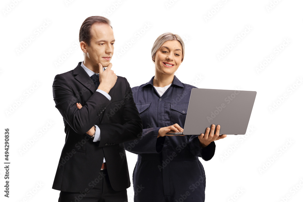 Female worker with a laptop computer and a businessman looking at the computer Female worker with a laptop computer and a businessman looking at the computer
