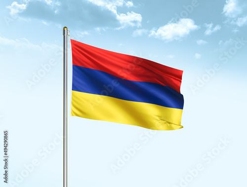 Armenia national flag waving in blue sky with clouds. Armenia flag. 3D illustration
