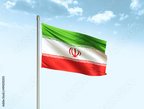 Iran national flag waving in blue sky with clouds. Iran flag. 3D illustration