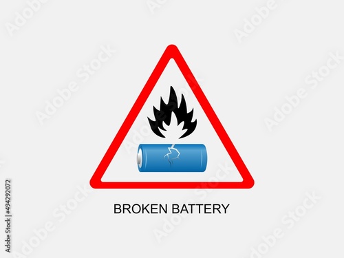 Damaged broken battery with fire hazard sign. Disposal of flammable batteries.