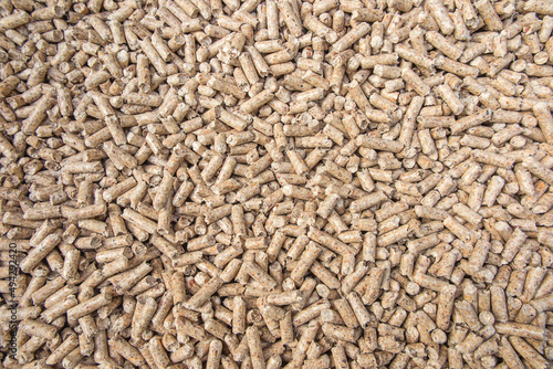 Wooden pellets used as fuel in ecological heating boilers.