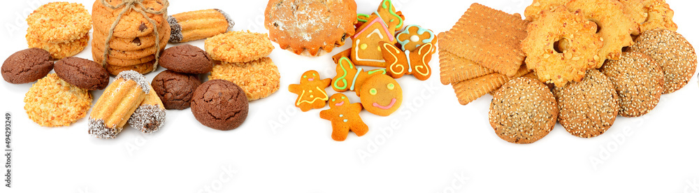 Cookies, gingerbread and muffin isolated on white . Skinali. Collage. Wide photo. Free space for text.