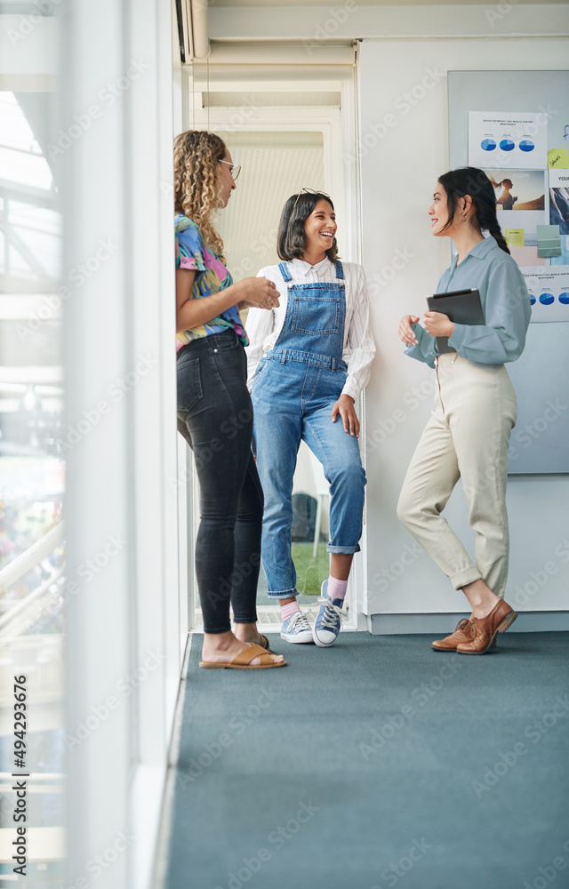 Catching up while making big plans. Shot of a group of businesswomen having a discussion in an office. Catching up while making big plans. Shot of a group of businesswomen having a discussion in an office.