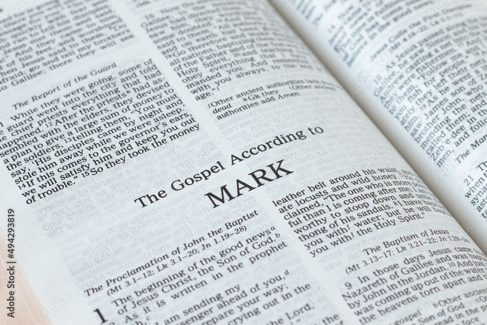 Mark Gospel from Holy Bible Book inspired by God and Jesus Christ, a closeup. New Testament Scripture isolated on a white background. Mark Gospel from Holy Bible Book inspired by God and Jesus Christ, a closeup. New Testament Scripture isolated on a white background.