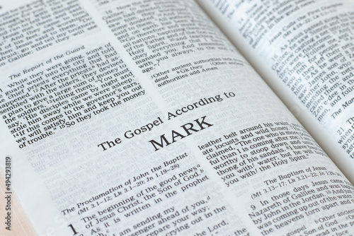 Mark Gospel from Holy Bible Book inspired by God and Jesus Christ, a closeup. New Testament Scripture isolated on a white background. 