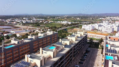 Aerial view of the urban area of portugal in the south of houses with modern infrastructure swimming pools overlooking the sea. Southern city of Portugal Olhao.