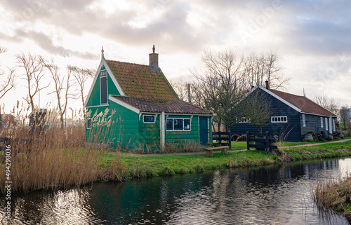 Scenic view of traditional wooden farmhouses in the countryside of Holland © Menyhert