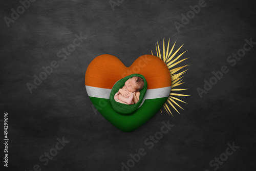 Canvas Print Newborn portrait on heart in color of national flag
