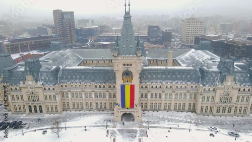 Aerial footage of Cultural palace from Iasi, Romania. The palace was filmed from a drone while flying forward towards the palaces central tower. Video was shot in winter while snowing. photo