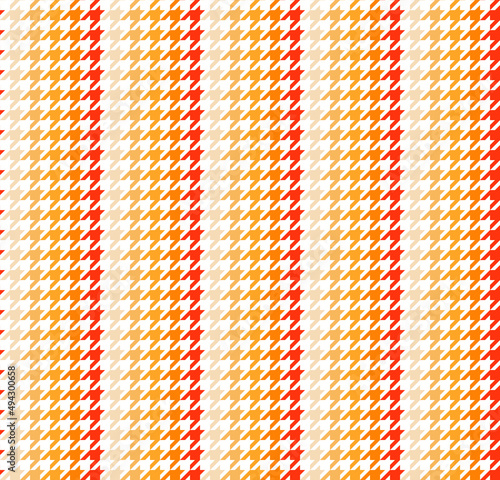 Orange hound stooth pattern cloth. Hounds tooth fabric background. Textile design pattern. Gradient orange color pattern on white backdrop.