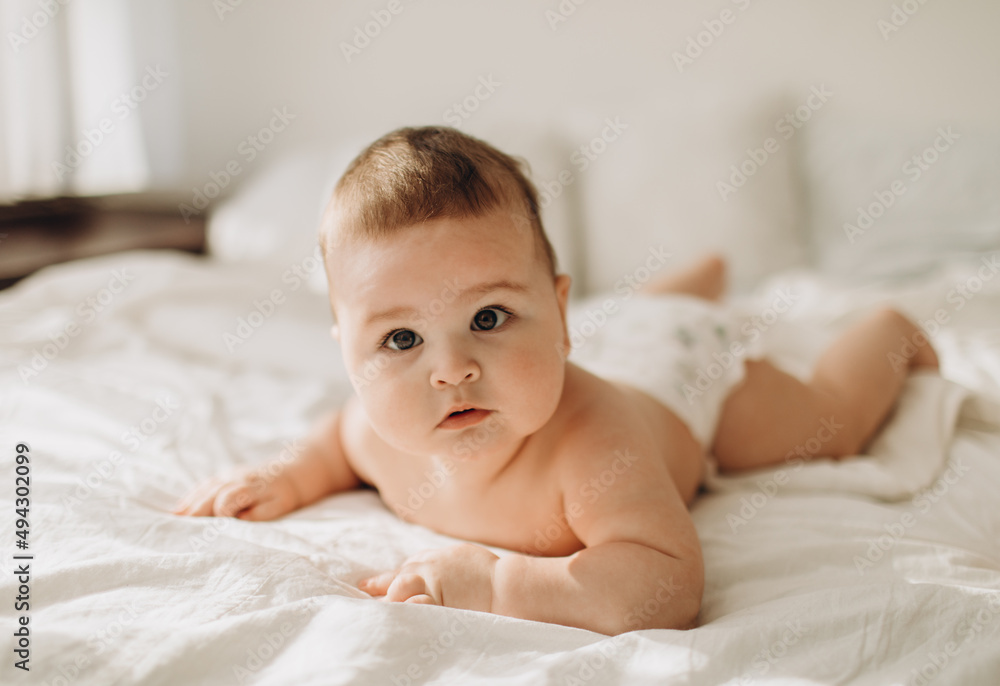 little boy lies on the bed
