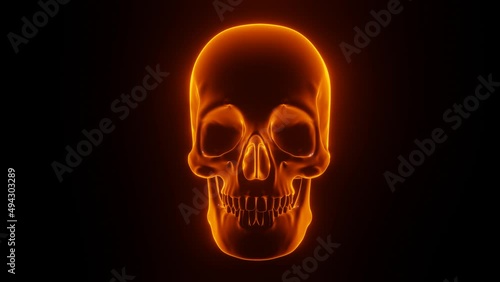 Glowing orange human skull consists of square particles, nods three times, and then zooms in and enlarges so much that only the eye sockets and part of the nose are visible. haunting animation on photo