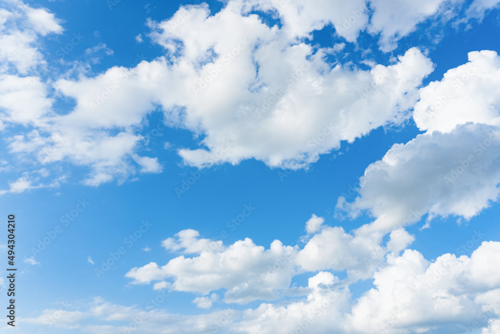 Fototapeta premium Clouds and blue sky. Cirrus and cumulus clouds on blue sky background.