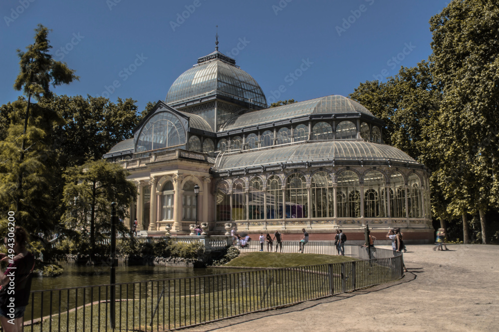 Photograph of the Crystal Palace in Parque del Retiro in Madrid with a sky full of clouds
