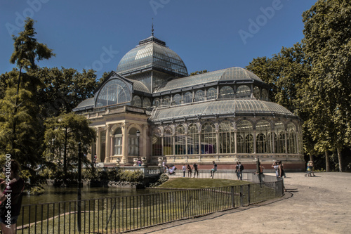 Photograph of the Crystal Palace in Parque del Retiro in Madrid with a sky full of clouds
