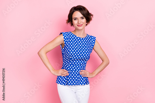 Photos Photo of nice millennial brunette lady wear blue top jeans isolated on pink colo