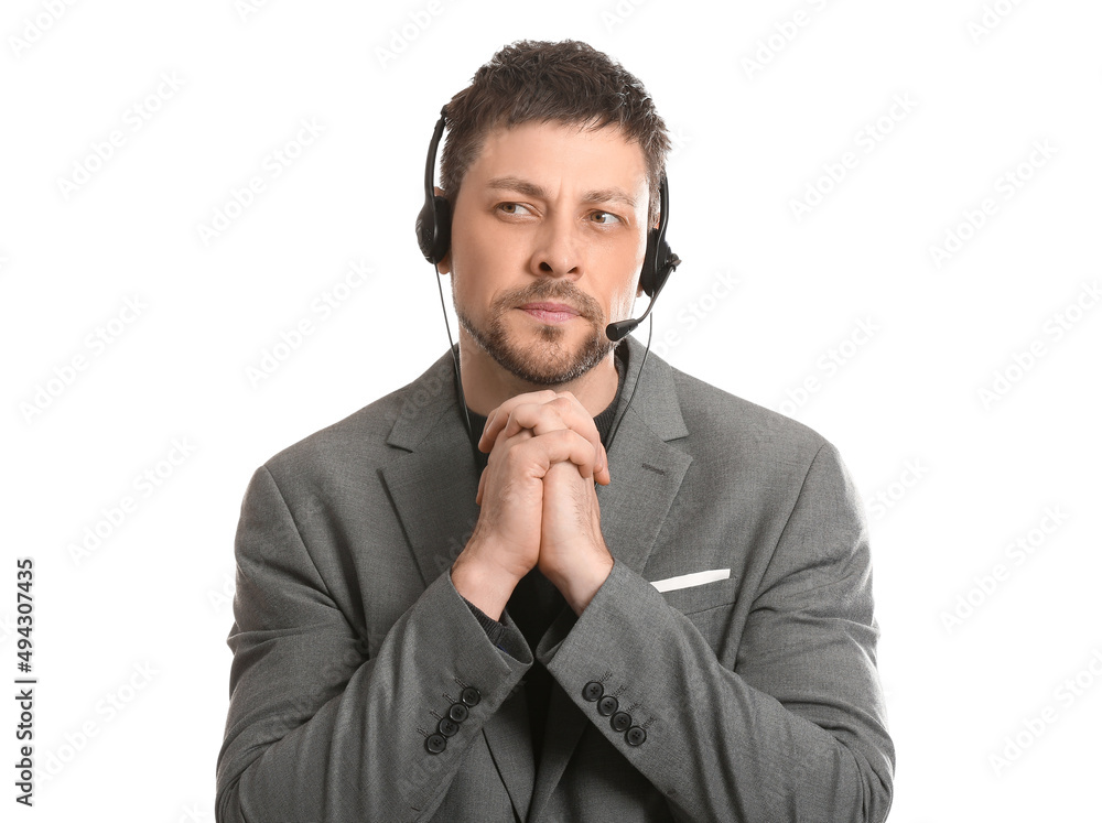 Thoughtful consultant of call center in suit with headset on white background Thoughtful consultant of call center in suit with headset on white background