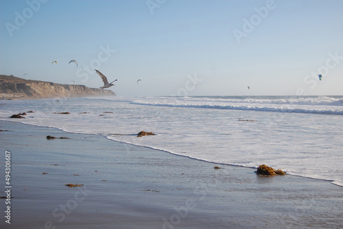 Kiteboarders enjoying a beautiful day in the Pacific Ocean, in Lompoc, Santa Barbara County, California.