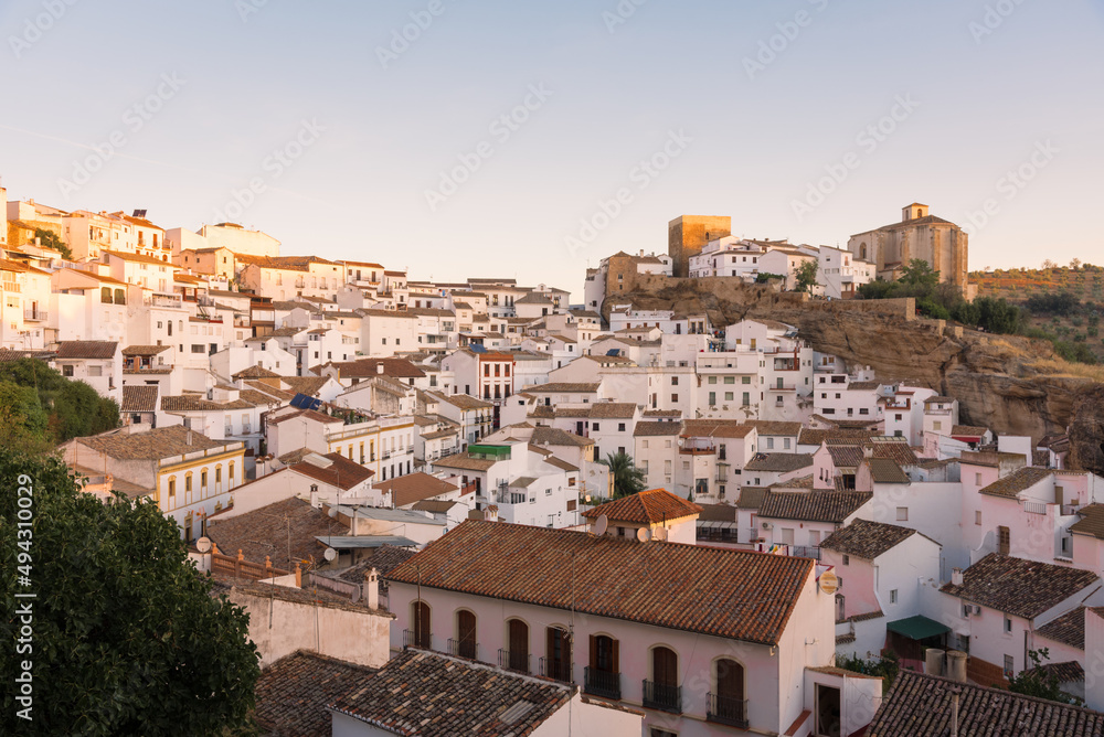 Scenic view of the beautiful and famous white village of Setenil de las Bodegas from a viewpoint at sunrise, Cadiz province, Andalusia, Spain