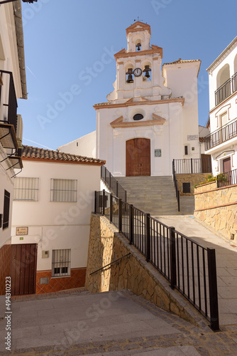 Our Lady of Antigua Parish in the old town of the beautiful andalusian white town of Torre Alhaquime in the Natural Park of Grazalema mountain range at daylight, Cadiz province, Andalusia, Spain photo