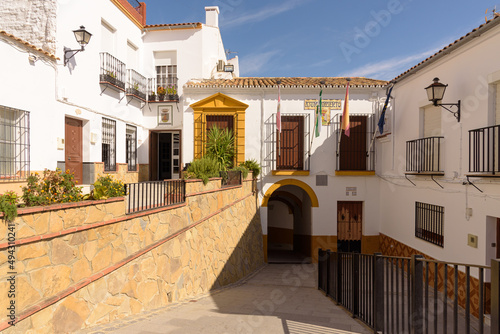 City hall in the old town of the beautiful andalusian white town of Torre Alhaquime in the Natural Park of Grazalema mountain range at daylight, Cadiz province, Andalusia, Spain photo