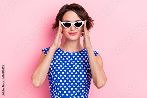 Photo of pretty young brunette lady wear eyewear blue top isolated on pink color background