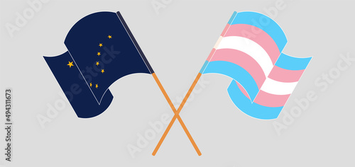 Crossed and waving flags of the State of Alaska and Transgender Pride