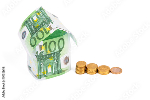 houses made of euro bills, isolated on a white background