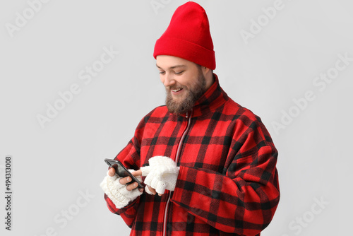 Young bearded man in warm g...