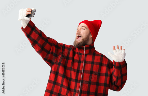 Young bearded man in warm g...