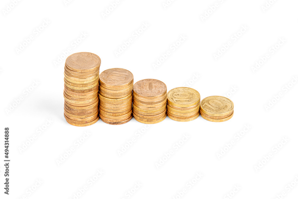 Stacks of coins of different heights isolated on a white background Stacks of coins of different heights isolated on a white background