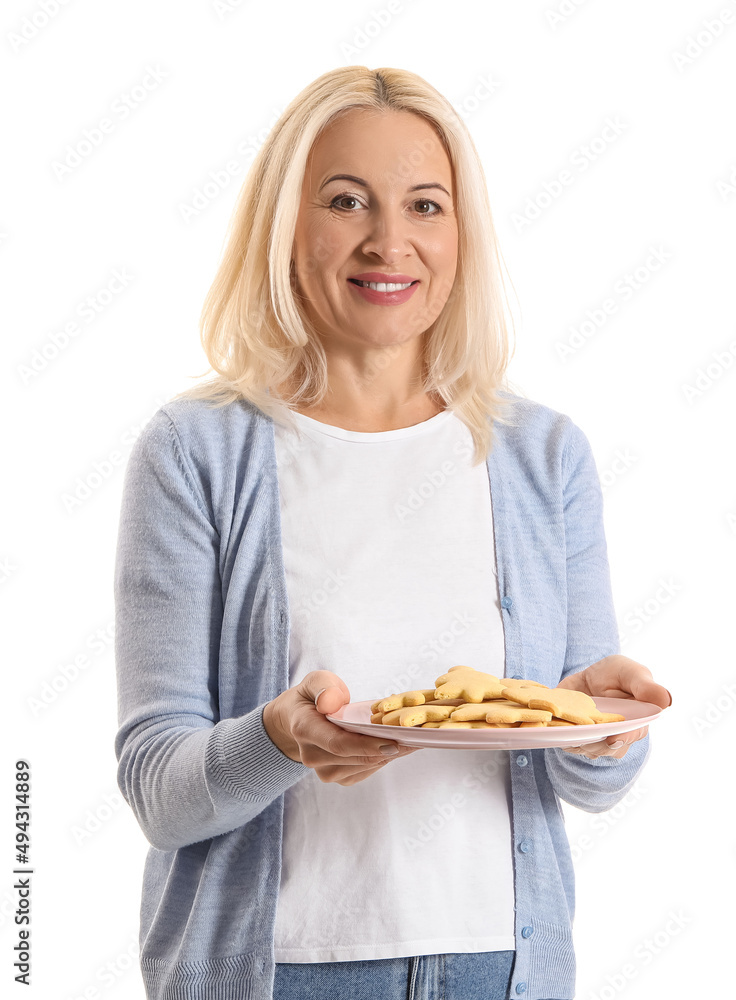 Mature woman holding plate with cookies on white background Mature woman holding plate with cookies on white background