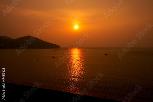 Beautiful sunrise at Black pearl Mongdol Beach in Geoje-si, South Korea.