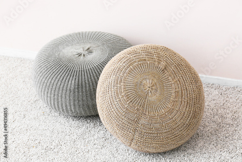 Modern poufs in room, closeup