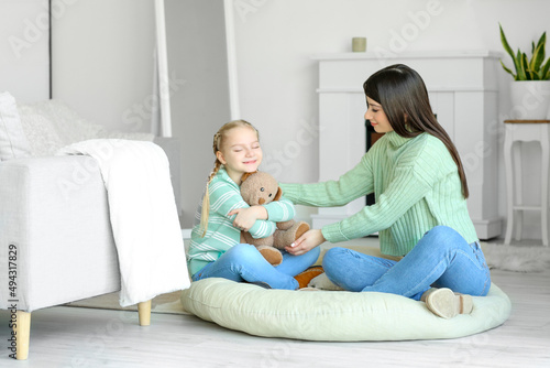 Happy little girl and her m...