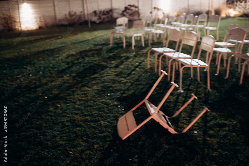 wedding ceremony preparation, wooden folding chairs