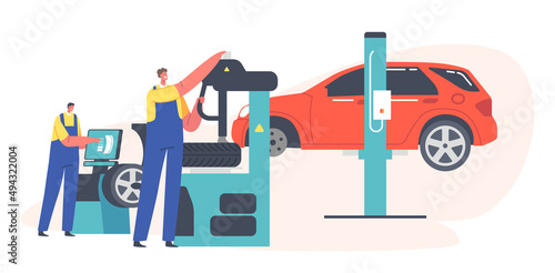 Roadside Vehicle Repair Service Workers Change and Mount Tires at Garage for Car Stand on Elevator. Men Replace Tyres