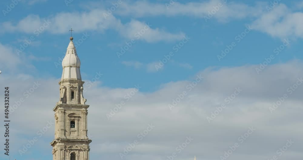 catholic church tower dome on the background of the sky and clouds. baroque church and renaissance classicism. overall plan catholic church tower dome on the background of the sky and clouds. baroque church and renaissance classicism. overall plan