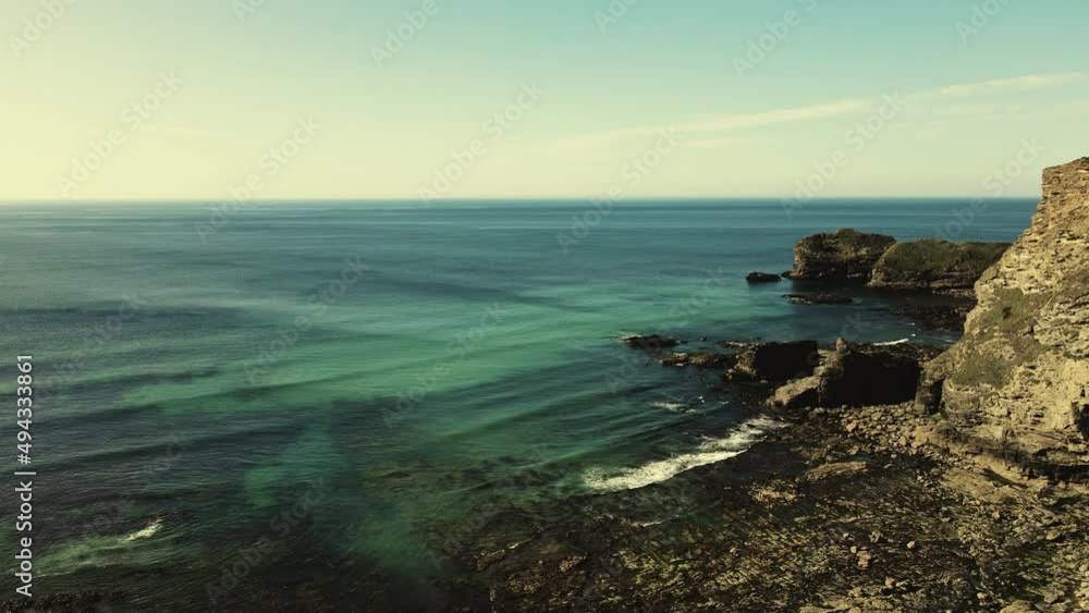 Seascape of the Atlantic Ocean bay with rocks above the water. Aerial view Seascape of the Atlantic Ocean bay with rocks above the water. Aerial view