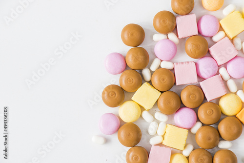 Sweet colorful confectionery, candy on the white background, high angle view photo