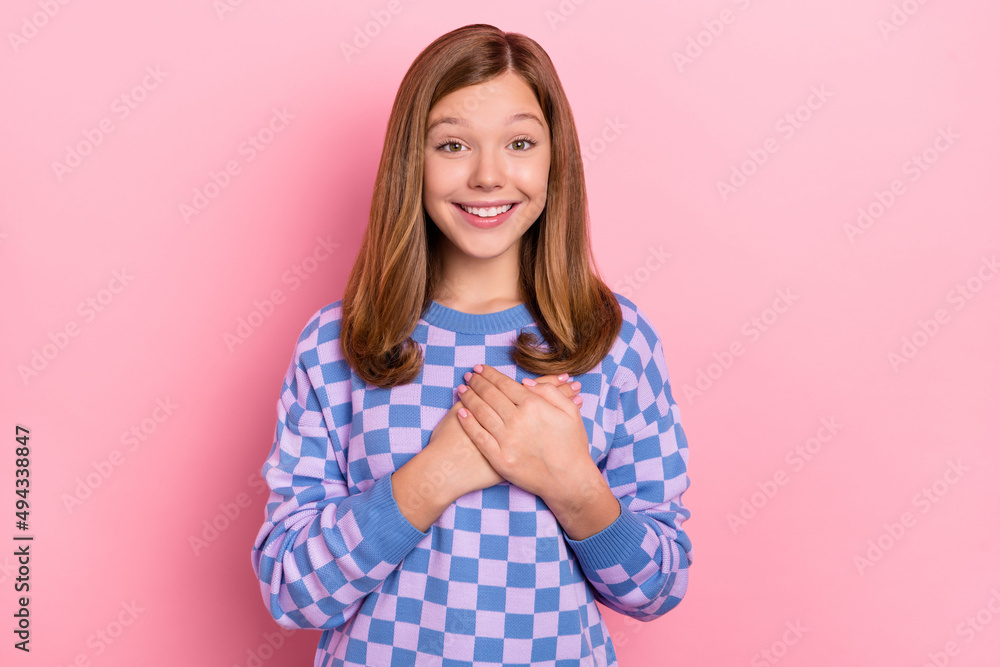 Photo of brown hairdo lovely teen girl hold hands wear blue sweater isolated on pink color background Photo of brown hairdo lovely teen girl hold hands wear blue sweater isolated on pink color background