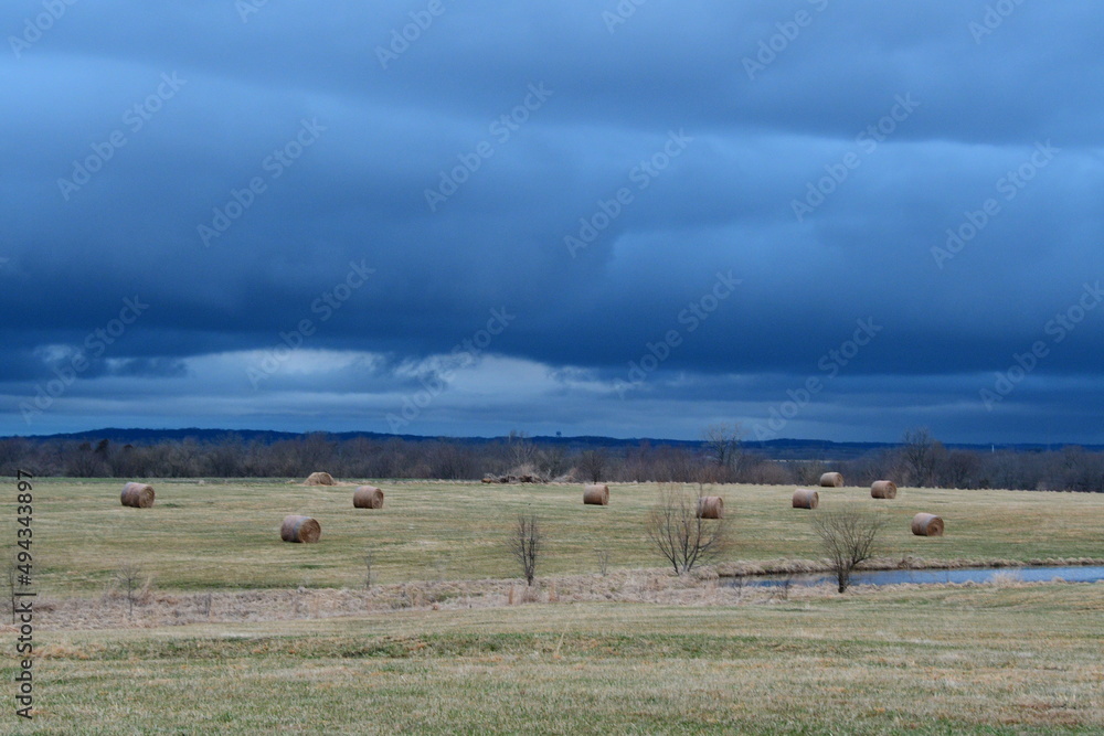 Storm Clouds Over a Hay Field