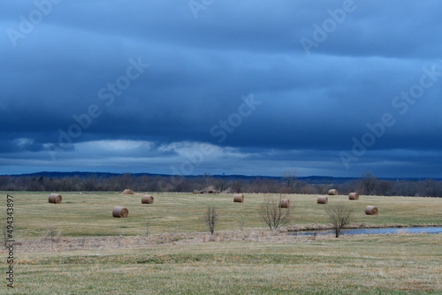 Storm Clouds Over a Hay Field