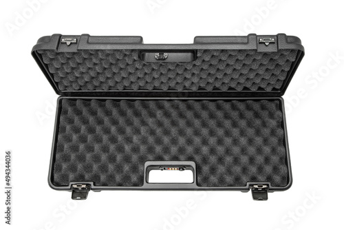 Open black plastic case with foam inside. Weapon case isolate on white background. photo